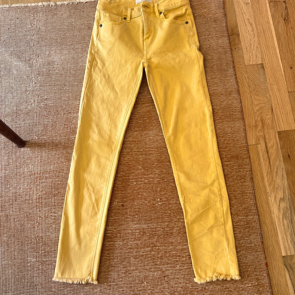 Mustard color fringe bottom stretch jeans